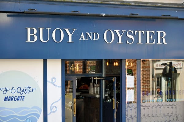 The blue frontage of a restaurant called Buoy and Oyster